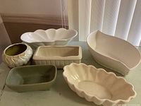 All six vintage ceramic planters grouped on table