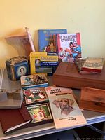 Overall lot showing View-Masters, books, MiniSew box, cedar boxes and tin