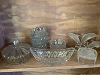 Wide view of all six crystal items on shelf