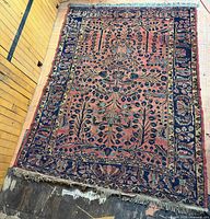 Full view of the Sarouk rug showing overall pattern and fringe