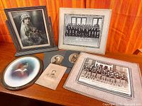 All seven photographs displayed together on tabletop