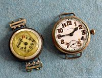 Two watches side by side showing dials and relative sizes