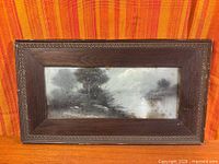 Full view of framed charcoal drawing