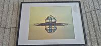 Front view of framed water drop photograph