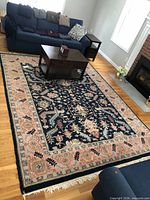 Full view of rug in room showing overall pattern and size