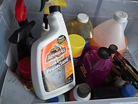 Top view of first tub showing Armor All spray, multiple bottles and cans