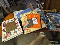 Overview of several books spread on table; titles visible