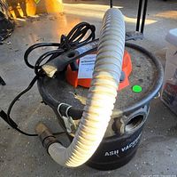 Cleva ash vacuum showing canister, motor housing, hose and power cord