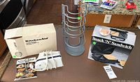All three items on countertop showing mixer, rack, boxed sandwich maker
