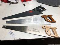 Top view of all three saws displaying full blades and handles
