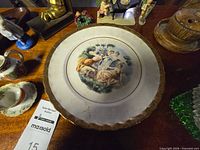 Close-up of Manhattan Ware plate with Classical scene and gold trim