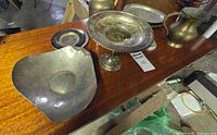 Overview of lot on table showing tray, small plate, compote, and brass pitcher