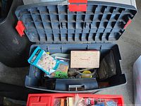 Toolbox open showing contents and red latch
