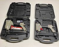 Two Porter-Cable nailers inside respective cases