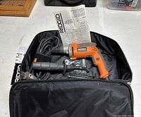 Rotary hammer with side handle, depth rod, manual and soft case