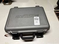 Closed grey RotoZip case exterior