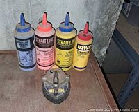 All five chalk bottles and Irwin chalk line reel