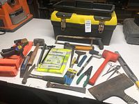All items laid out with toolbox for scale