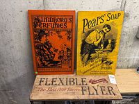 All three wood advertising plaques displayed together