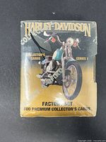 Front of factory box shows branding, motorcycle image and card count