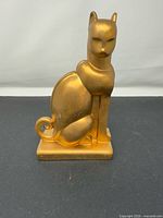 Front view of gold Art Deco style cat statue
