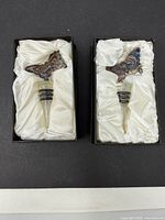 Pair of glass butterfly wine stoppers in boxes