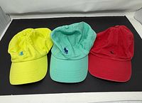 Front view of three Polo Ralph Lauren caps showing colors and embroidered logos