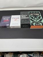 Four boxed party games side by side