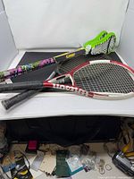 Tennis rackets and water lacrosse sticks group shot