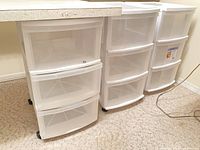 Three Gracious Living plastic drawer units side by side