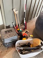 Lot overview with polisher case, tote of sprayer parts, brushes and bottles