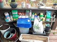 Shelf with fertilizers, pots, bin, planter