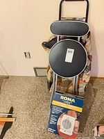 All three items: boxed Rona heater, folding stool, wheeled shopping cart