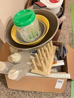 Overview of nested bowls, pitcher, fry cutter, jugs and shelf liner in box