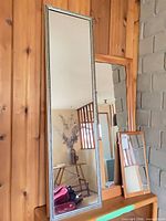 All three mirrors on shelf for scale