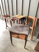 group of all four wooden furniture pieces leaning against wall