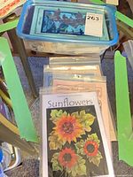 Blue-lid plastic container holding Pine Meadows Designs First Light quilt kit