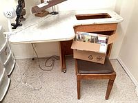 Table, stool and box of books overall view