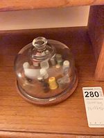Entire lot under glass dome on shelf