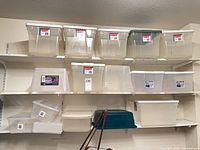 Front view of totes on shelves showing quantity and sizes