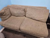 Front view of two-seat couch showing cushions and upholstery