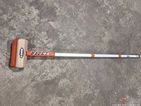 Full view of broom showing length, shaft graphics, head