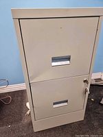 Front view of two-drawer metal filing cabinet