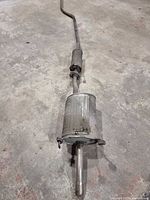 Full view of exhaust assembly showing muffler, resonator and piping