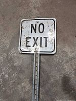 Close view of sign face showing lettering and condition