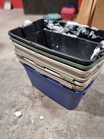 Stacked plastic bins showing colours and condition