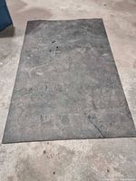 Full view of rubber flooring roll laid flat on concrete floor