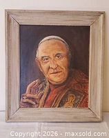 Full view of framed oil portrait in neutral lighting