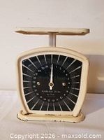 Front view showing dial, pointer and overall design