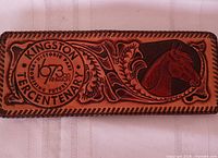 Front exterior showing Kingston Tercentenary crest and horse motif